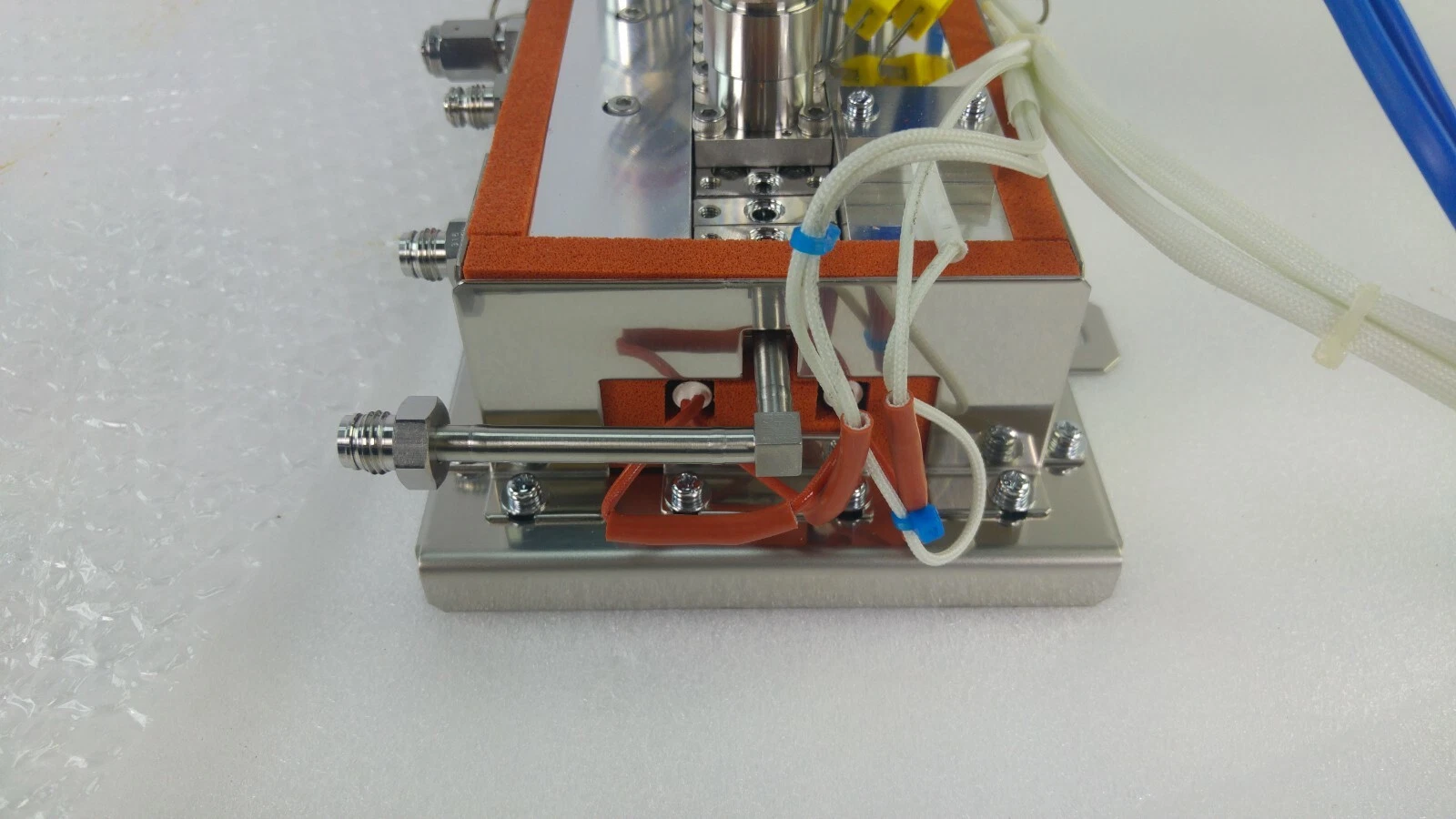 Opposite end of the 1091-082-01 gas box with tube fitting and orange jacket