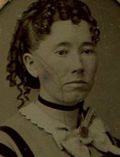 WOMAN, WEAK CHIN, RINGLET CURLS. TINTYPE, PERIOD PAPER MAT.