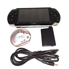 PSP 3000 console with memory stick, charger and battery