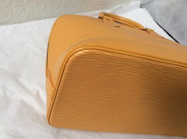 BOLSO DE MANO LOUIS VUITTON EPI ALMA MONEDERO Foto 2 de 4