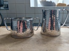 Oldehall hammered Art Deco Staybrite steel matching sugar bowl and cream jug.