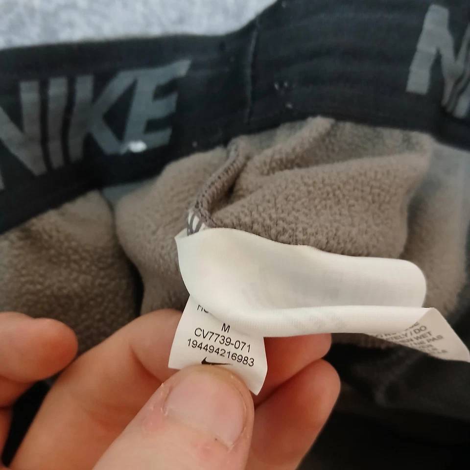 Pantalones de entrenamiento Nike Therma-Fit para hombre gris medio cálidos cónicos CV7739-071 Foto 4 de 4