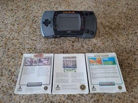 Vintage Atari Lynx Video game system and 3 Sealed Games brand new !!