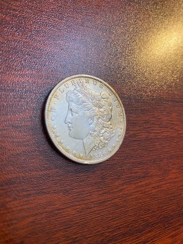 1886-O Morgan $1 – AU Circulated – Better New Orleans Semi-Key Date