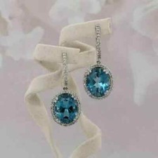 4Ct Oval Cut Lab-Created Blue Topaz Drop/Dangle Earrings 14K White Gold Plated