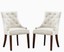 cream/tan colored set of tufted fabric dining chairs with handle at the back