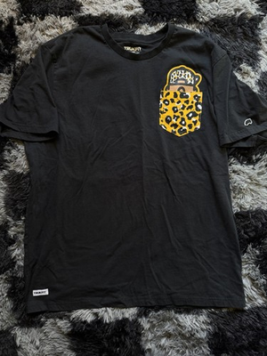 #ad Trukfit x Lil Wayne Graphic Pocket T Shirt with Leopard Print Details $25.00