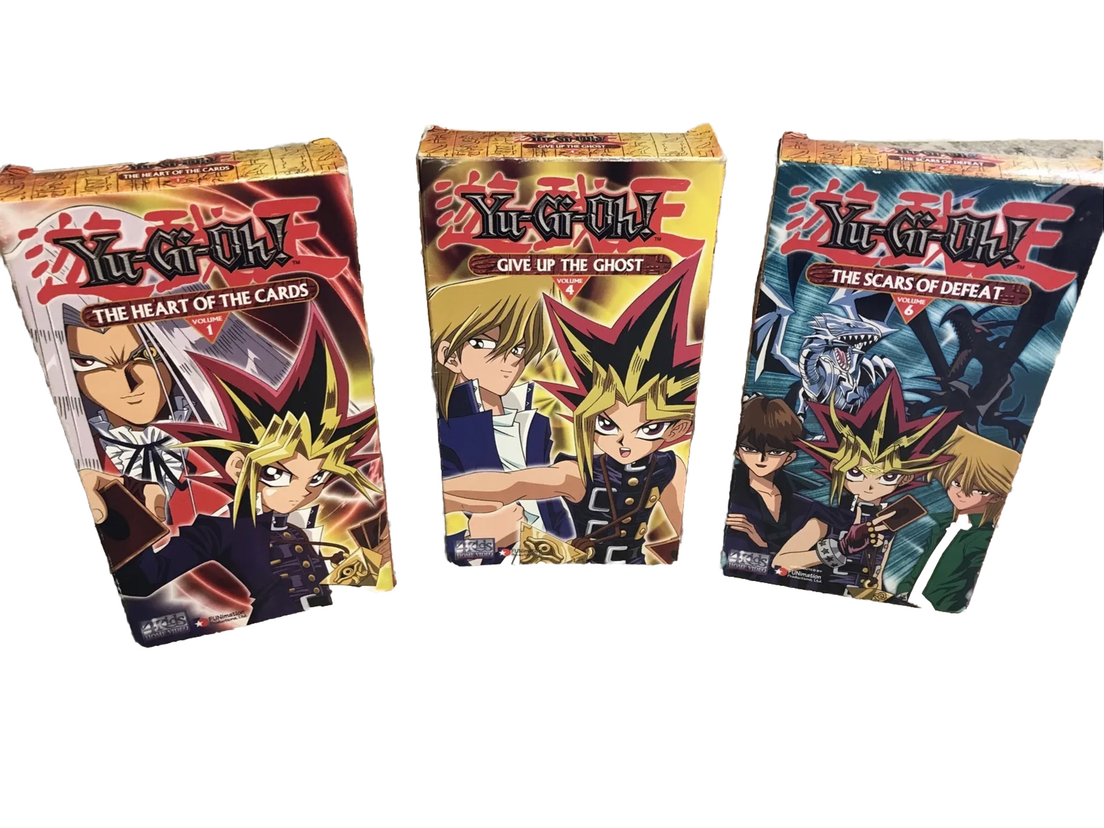 3 YuGiOh VHS Tapes 1 The Heart of the Cards 4 Give Up Ghost 6 Scars