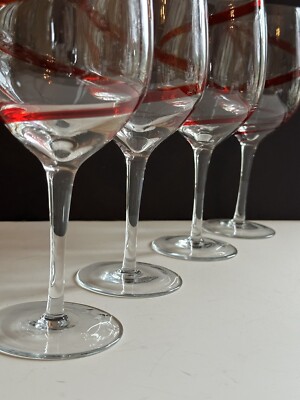 a set of 12 wine glasses Everything Collection