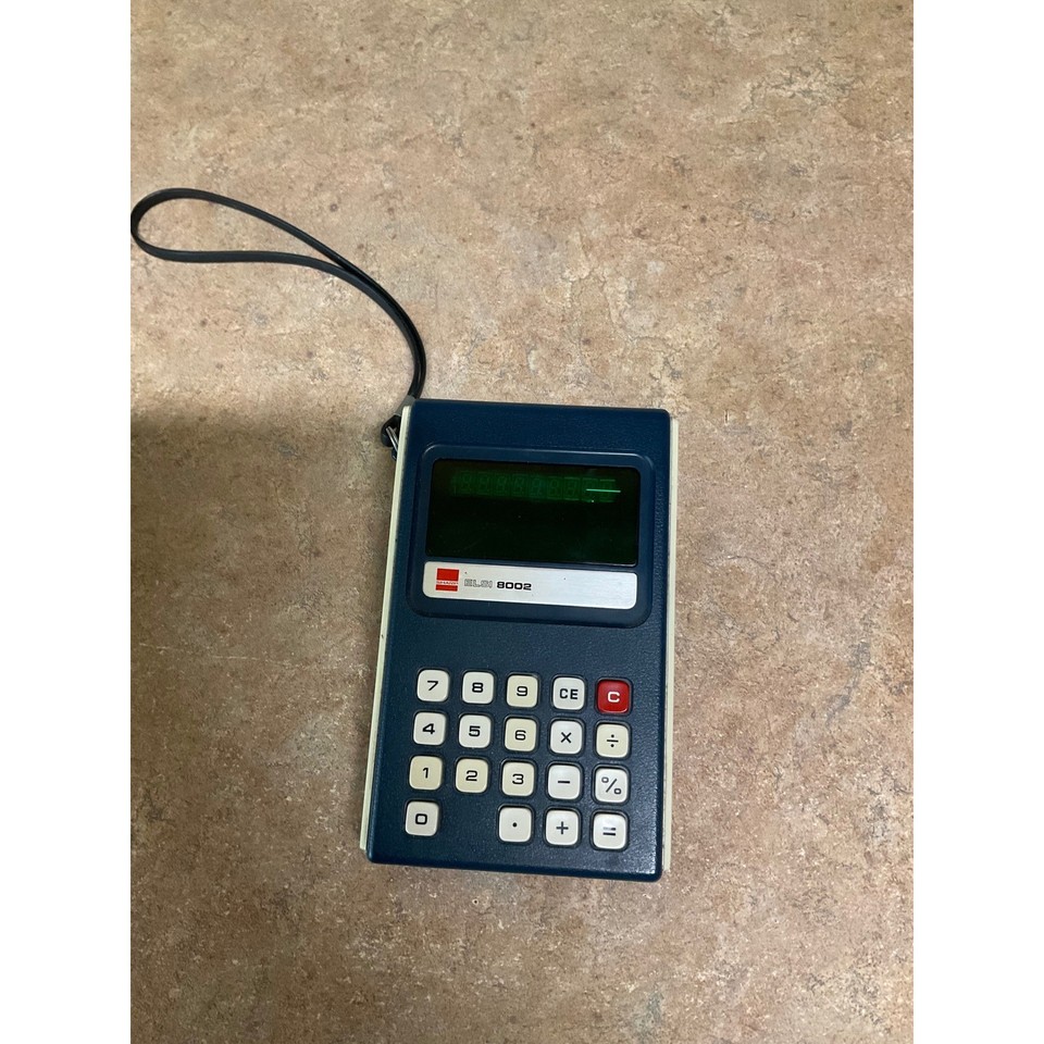 One of the earliest consumer calculators with a glowing VFD display — a tiny glowing relic of 1970s Japanese engineering elegance.