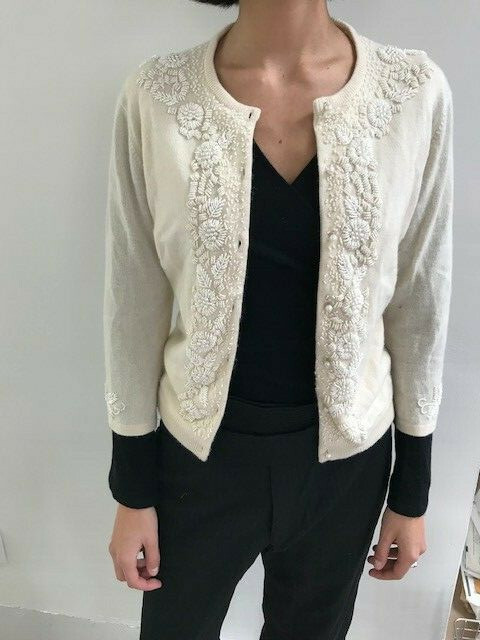 cream cardigan with pearls