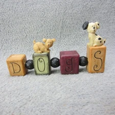 Blossom Bucket Suzi Skoglund DOGS Spelled in Lettered Blocks Resin Figurine