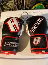 revgear 18 oz Boxing /Sparring gloves good condition black white and red color