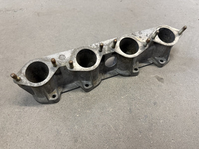 1977-1979 BMW E21 320i M10 Early Lower Intake Manifold Mount OEM 1257024