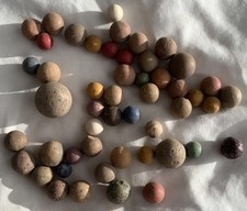 50 Vintage Clay Marbles Various Sizes and Colors. Large shooter included.