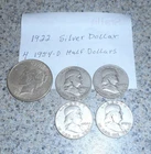 1 Silver Dollar & 4 Ben Franklin Half Dollars