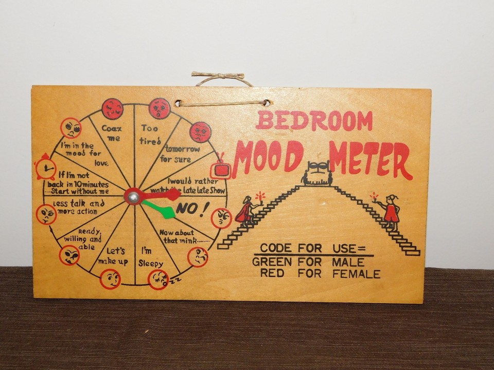 A vintage wood 'Bedroom Mood Meter' novelty sign — cheesy, tactile, and genuinely funny in the way only pre-internet gag gifts can be.