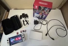 Year old Hardly Used Nintendo Switch OLED with carry case and 4 games
