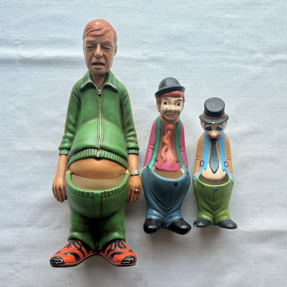Three-piece set of cheeky 1980s ceramic 'naughty' potbelly novelty planters — the kind of risqué kitsch that lives on a shelf and starts every conversation.