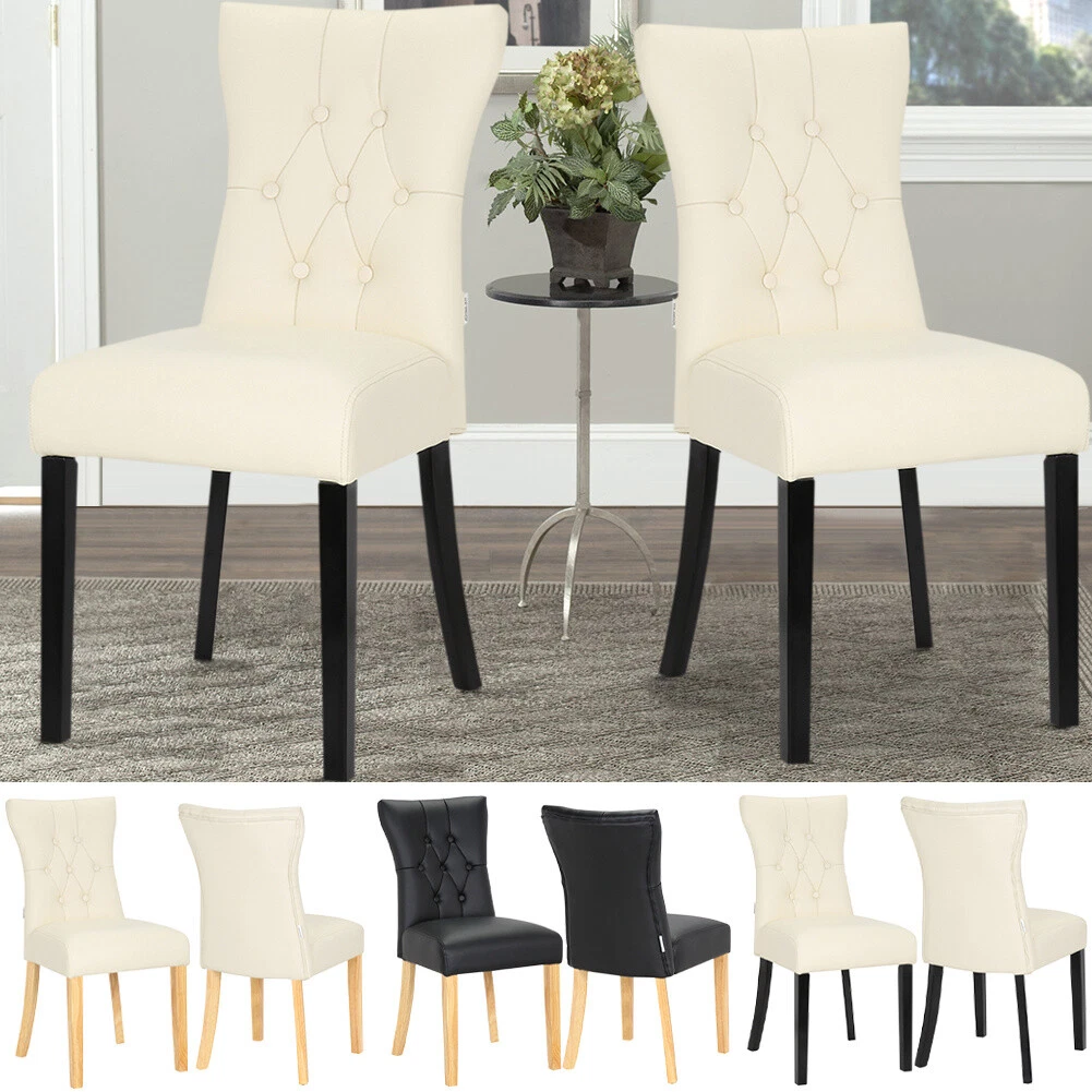 Leather wingback 2024 dining chair