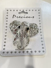 Vintage precious silver tone elephant with black rhinestone eyes brooch pin