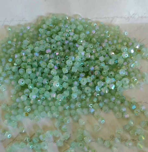 Swarovski 5328 3mm bicone beads, Chrysolite Opal Shimmer 2X (36pcs) - Picture 2 of 2
