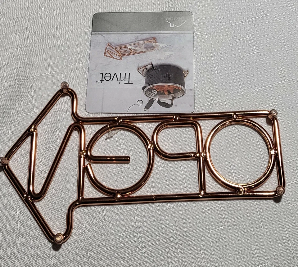 SPECTRUM "OPEN" TRIVET BRASS TONE METAL CUT OUT 8.5" LONG NEW WITH TAG - Image 2 of 4