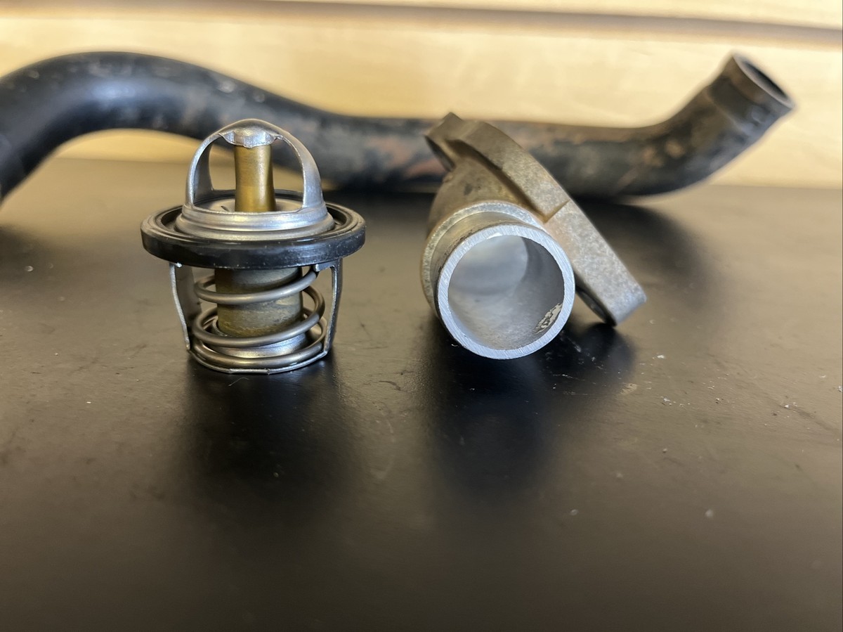 2003-2006 Kawasaki KFX 400 Thermostat , Housing Cover , and Hose