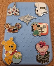 Disney 7-pin trading pack with pin board. 