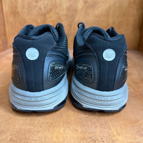 Black and gray New Balance 1540V2 men’s running shoes with mesh backs, suede overlays, and gray “ENC” logo on sides.