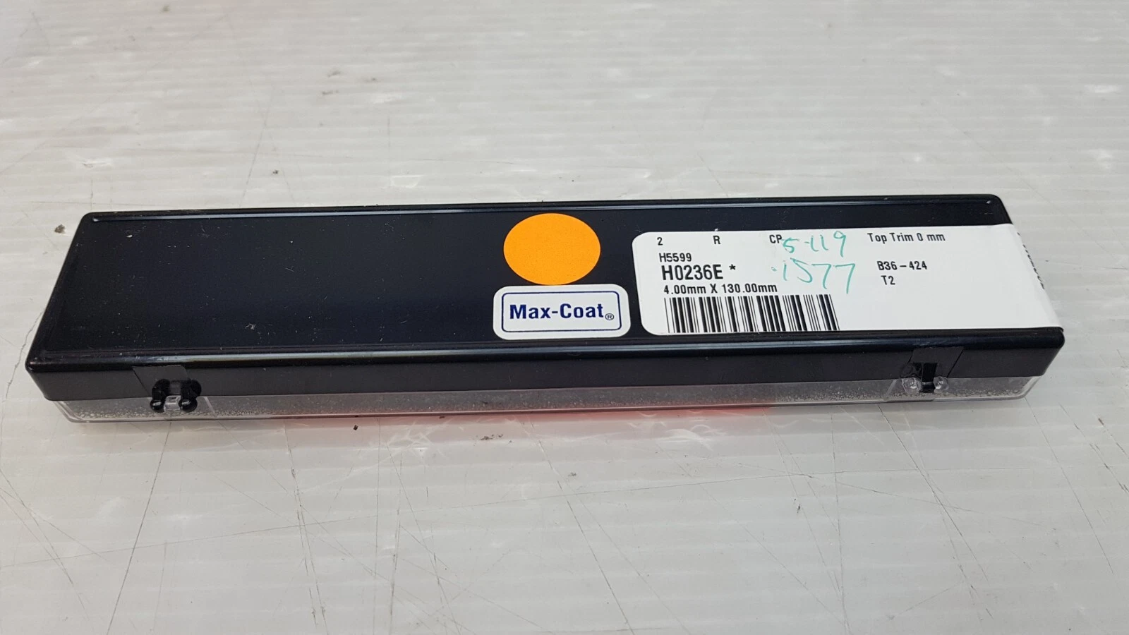 Black rod case with H0236E Max-Coat label and orange dot