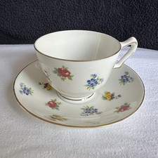 CROWN STAFFORDSHIRE bone china cup and saucer set; floral pattern, gold trim