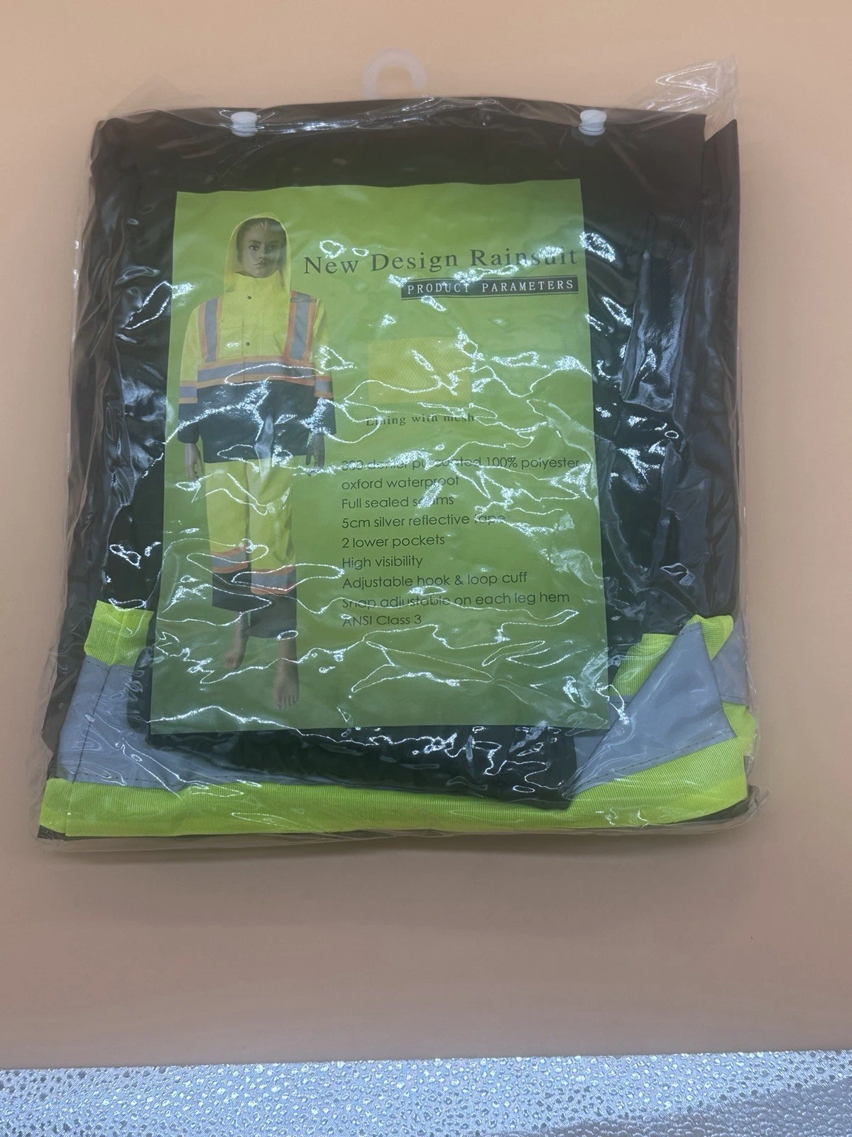 The Safety RAINSUIT for adults is a yellow polyester jacket with a zip closure,