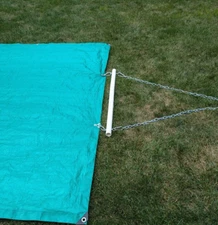 Tarp attachment kit for lawn tractor to transport leaves, mulch, dirt, etc.