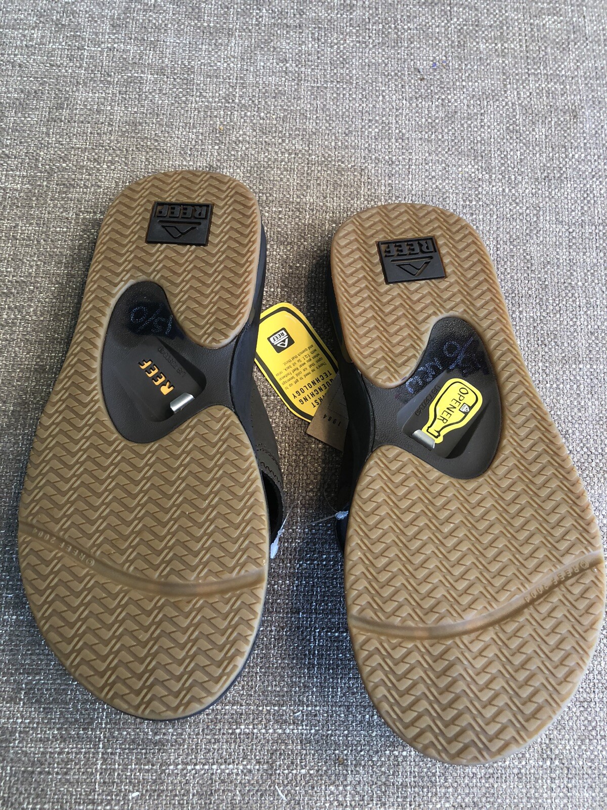 reef sandals bottle opener