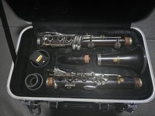 Used Jupiter 1100 Series Wood Clarinet with mouthpiece, ligature, and reeds