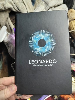 black notebook promoting Leonardo, a learning platform created by...