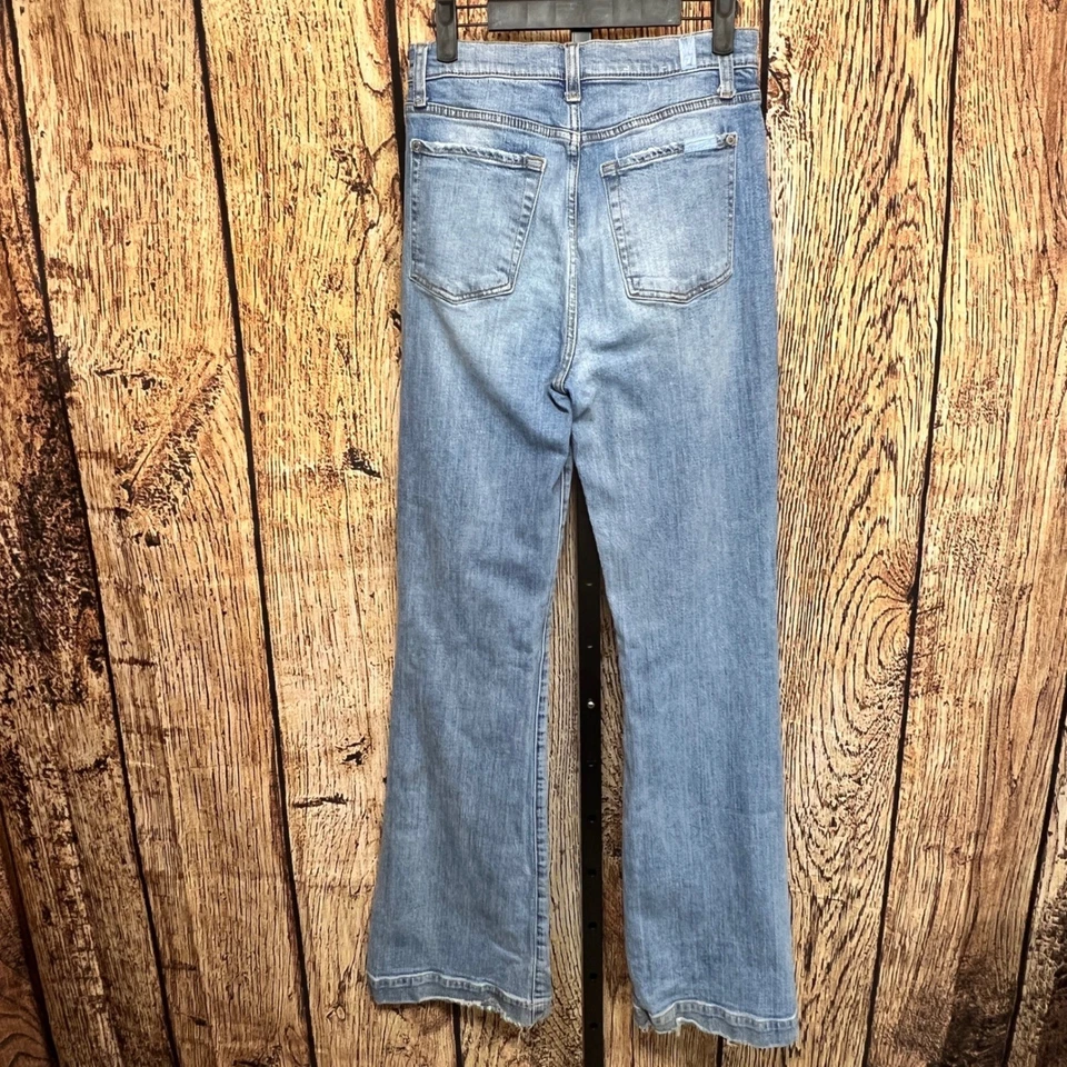 Pantalones de mezclilla desgastados 7 For All Mankind tiro ultra alto dojo pierna ancha para mujer LEER Foto 2 de 4