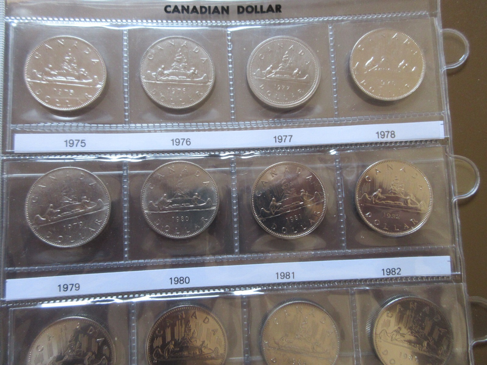 Set of Canada Nickel Dollars Coins Brown UNI-SAFE Album 1968-1986. UNC Coins