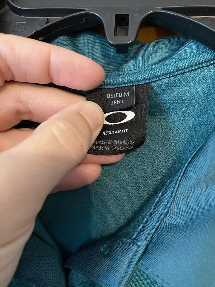 Camisa polo para mujer sin mangas con logotipo Oakley talla mediana golf verde azulado cuello con botones  Foto 4 de 4