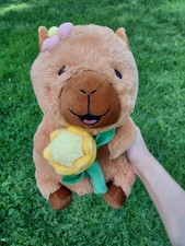 Capybara Plush Holding Yellow Flower With Pin...