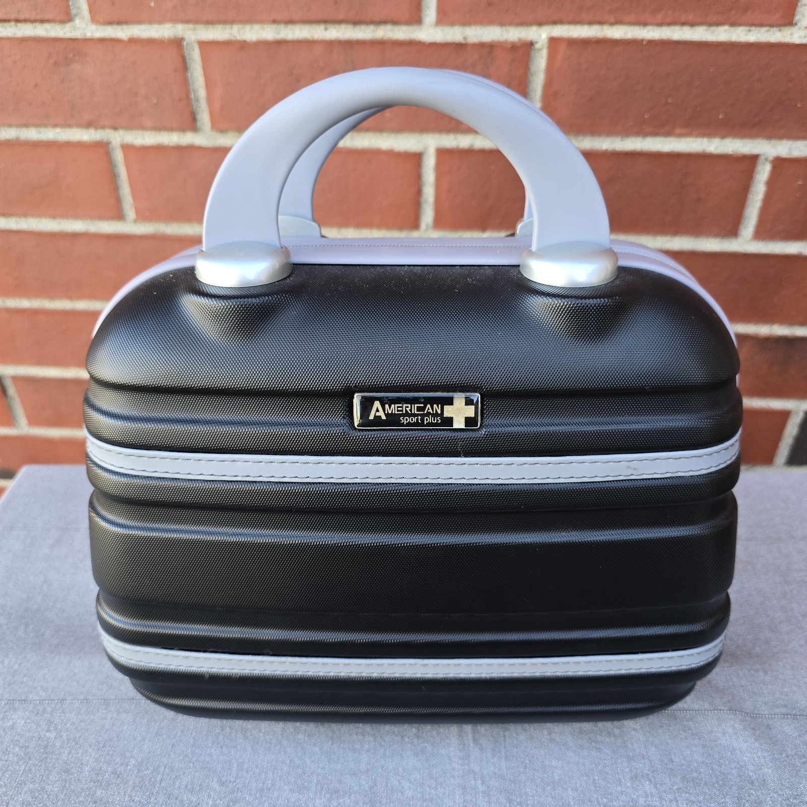 American Sport Plus Black Varsity Hardside Carry-On Case Lug