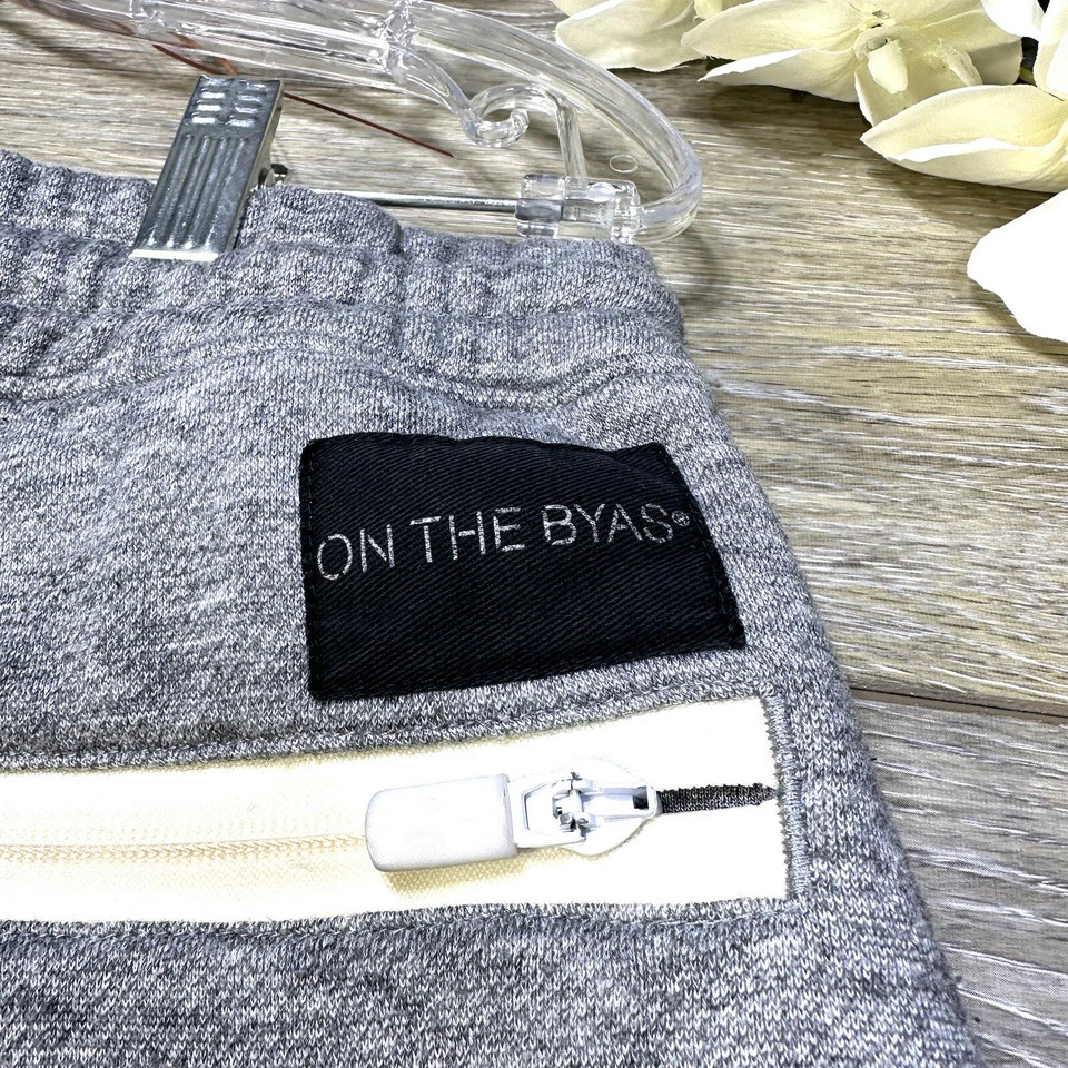 Pantalones deportivos Jogger talla mediana para hombre gris cintura elástica bolsillos con cremallera en el byas Foto 3 de 4