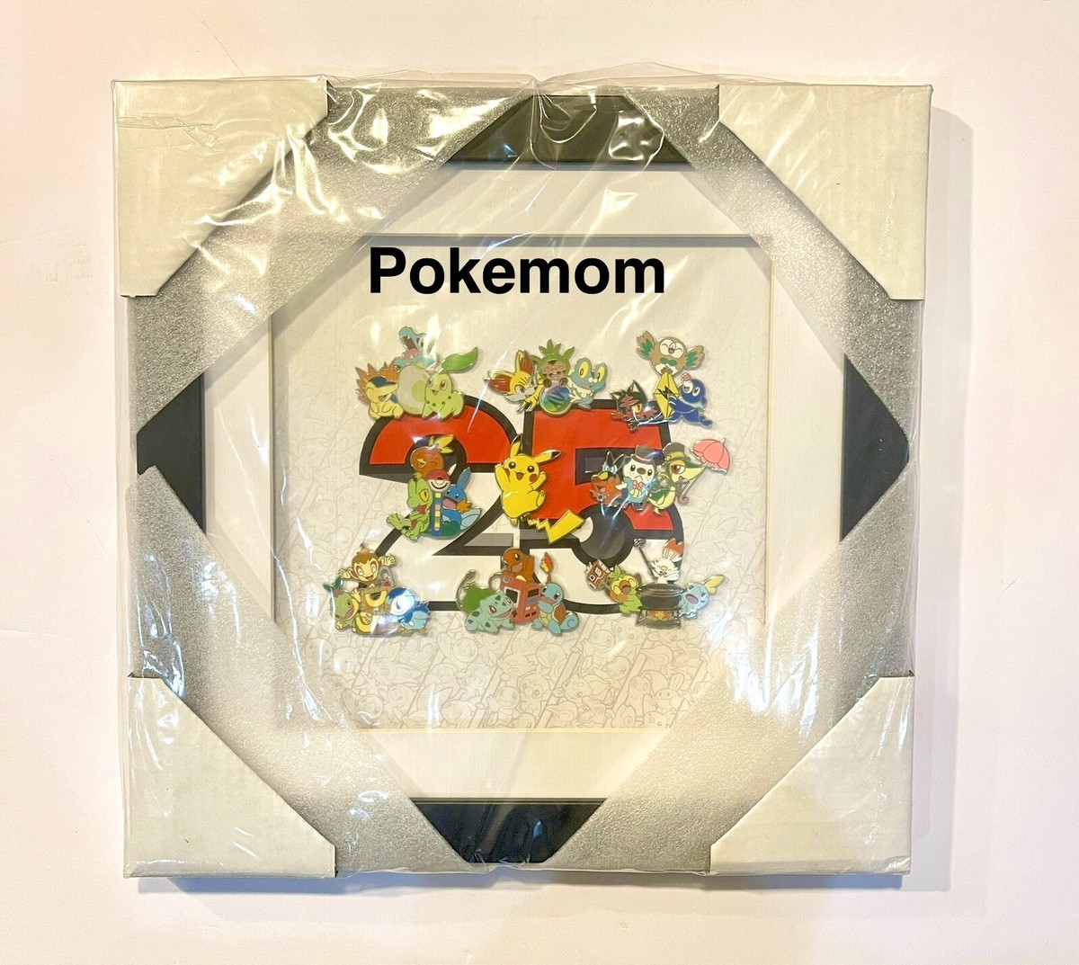 Official Pokémon Celebration Framed Pin Set - koleksi 39 pin dari tahun 1996 hingga 2025