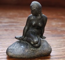 VINTAGE PATINAED METAL MERMAID ON ROCK FIGURINE 2.75" X 3"