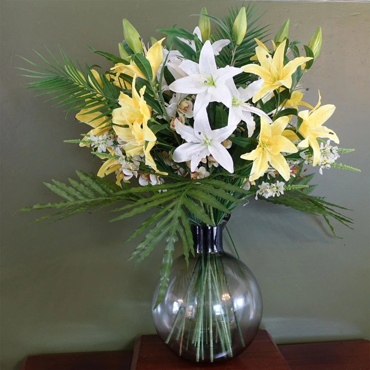 Artificial lily flowers in cheap vase