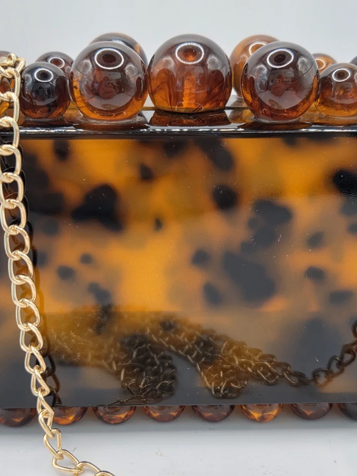 Cartera clutch Yendi leopardo tortuga acrílico Foto 3 de 4