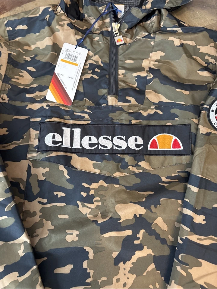 Nuevo con etiquetas Cortavientos Ellesse Mont 2 Oh Para Hombres 1/4 Cremallera Con Capucha Estampado Camuflaje Talla Pequeña Foto 2 de 4