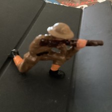 Grey Iron Soldier Firing Rifle Kneeling