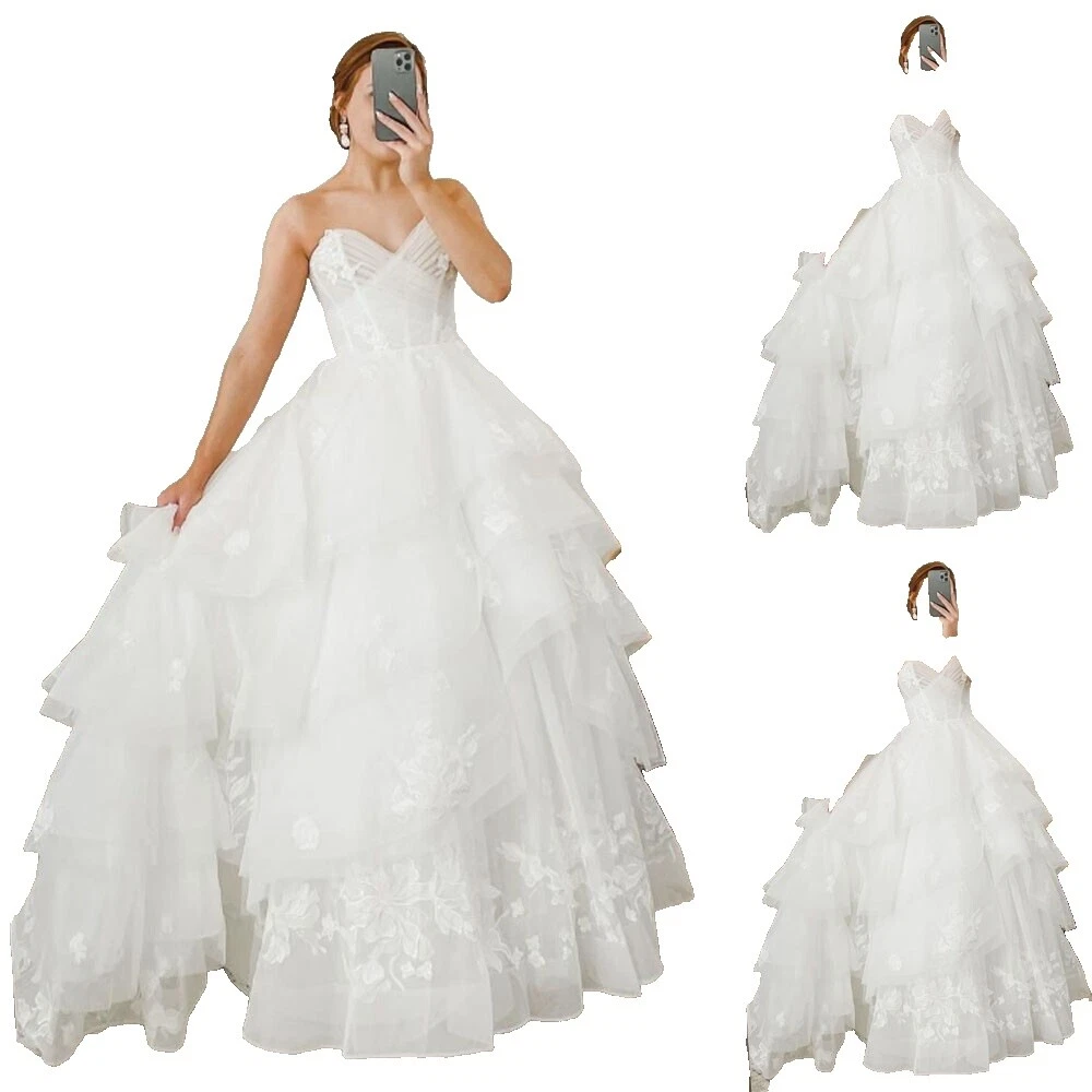 Sirena con volados y vestidos de novia con mangas de Trompeta